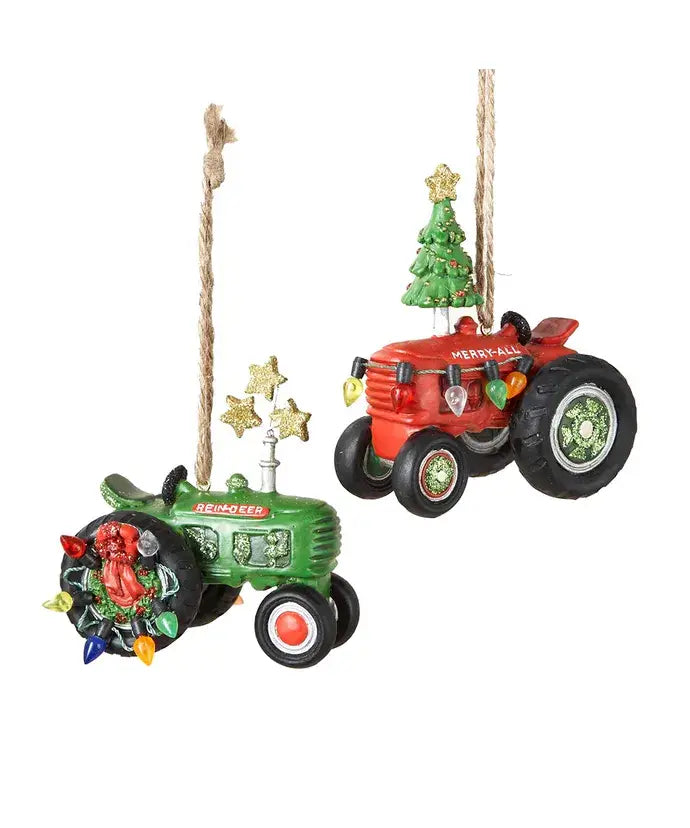 Two Christmas ornaments shaped like tractors on a white background