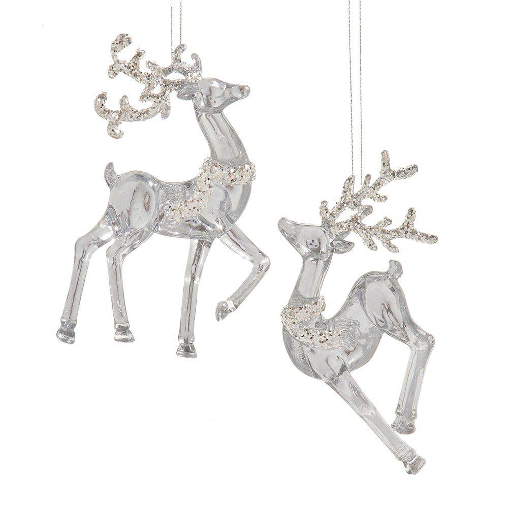 Decorative reindeer ornaments with crystal embellishments on a white background