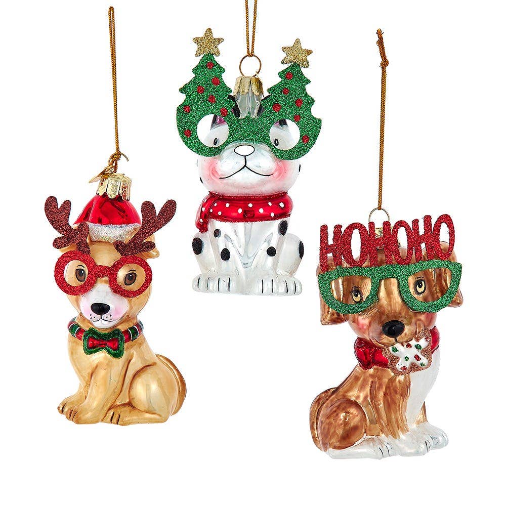 Three festive dog ornaments with Christmas-themed accessories on a white background