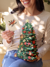 Load image into Gallery viewer, FreshCut Paper LLC - Twinkling Poinsettia Christmas Tree Lights Up